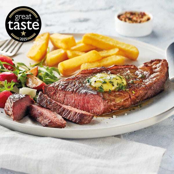 Steak with fries and salad on a plate, featuring the Great Taste 2025 logo.